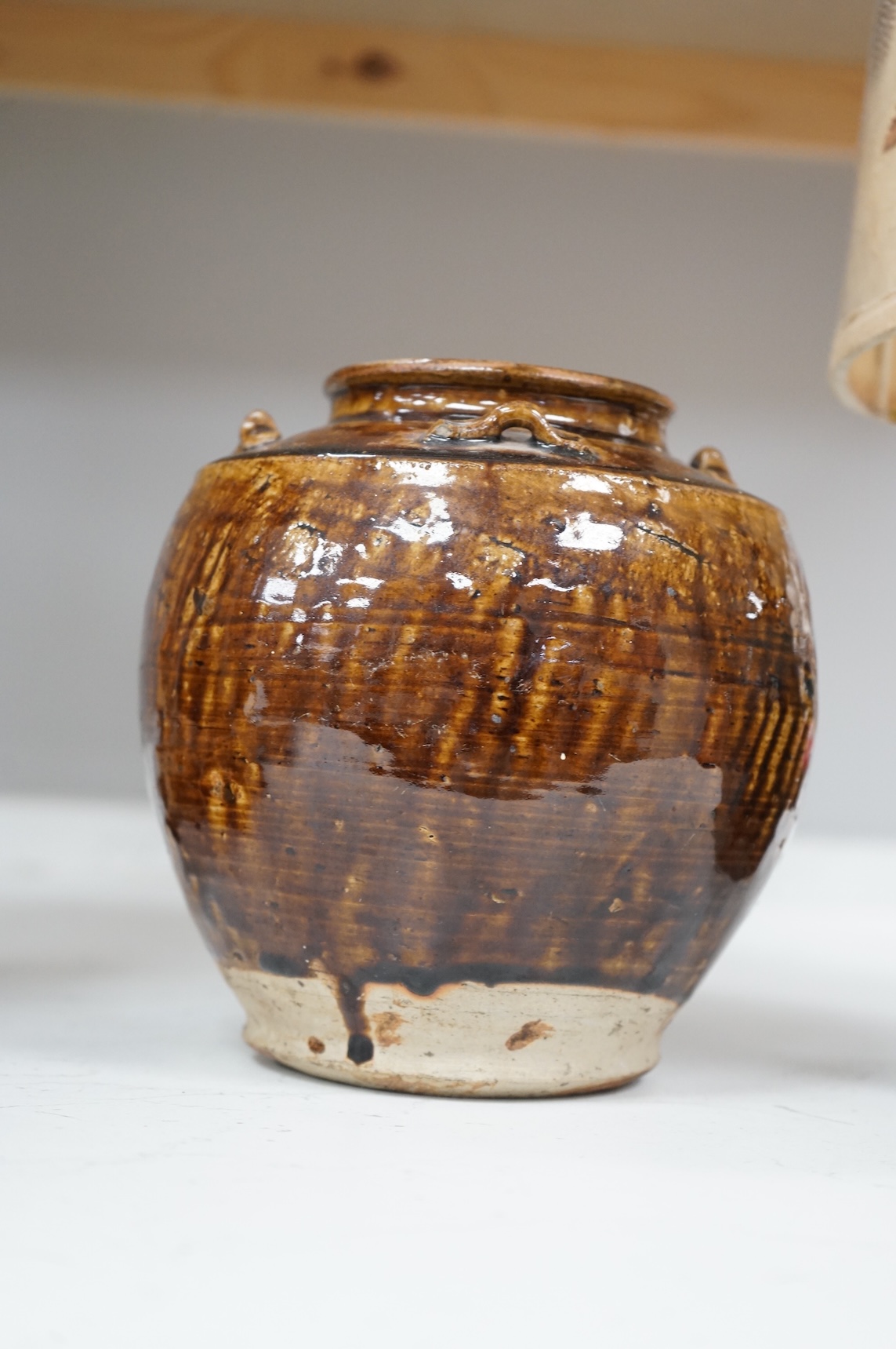 Two Chinese glazed pots, one converted as a lamp with a pressed floral shade, largest overall 37cm high